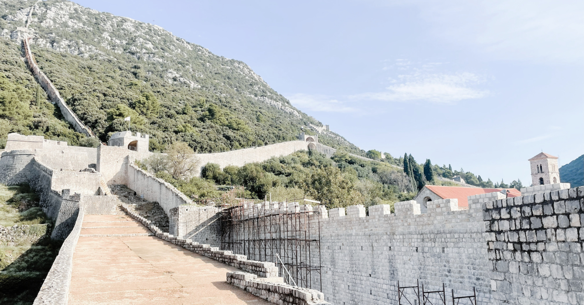 image from the wall of Ston, looking up the mountain with more walls - Featured Image